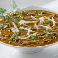 Dal Makhani · Rajma, Black Lentils, Green Moong beans cooked in Tomato and garlic ghee tadka  paired with ...