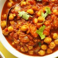 Kadahi Channa Masala · Garbanzo Beans Cooked In Tomatoes and Spices.