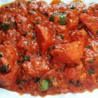 Chicken Tikka Masala · Marinated juicy chicken in yogurt and grilled with slightly spicy tomato Sauce