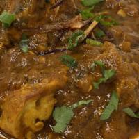 Chicken Vindaloo · chicken cooked with potatoes, onions, ginger, garlic, and ground spices in a hot and tangy s...