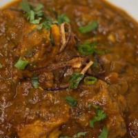 Lamb Vindaloo · Lamb and potatoes cooked in a sweet and sour sauce with a blend of hot chilies and spices
