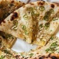Chilli Garlic Naan · Naan with garlic, Chili, and cilantro cooked in Clay Oven Tandoor to perfection.