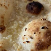 Butter Naan · Butter naan cooked in Clay Oven Tandoor to perfection.