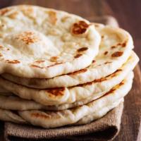 Plain Naan · Made freshly in Clay Oven Tandoor with organic flour.