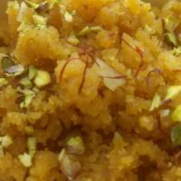 Moong Dal Halwa · Yellow lentils mash, cooked in ghee Topped with caramelized peanuts.