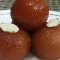 Gulab Jamun · Fried dough balls soaked in sugar syrup