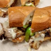 Philly Tri-Tip Sandwich · Served on sourdough roll with jack cheese. Grilled onions and bell peppers.