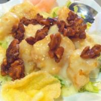 Walnut Shrimp · Battered prawns tossed in Pearl River's signature creamy sauce topped with honey roasted wal...