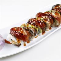 Dragon Roll · Shrimp tempura topped with choice of eel or albacore. Roll with sesame seed.
