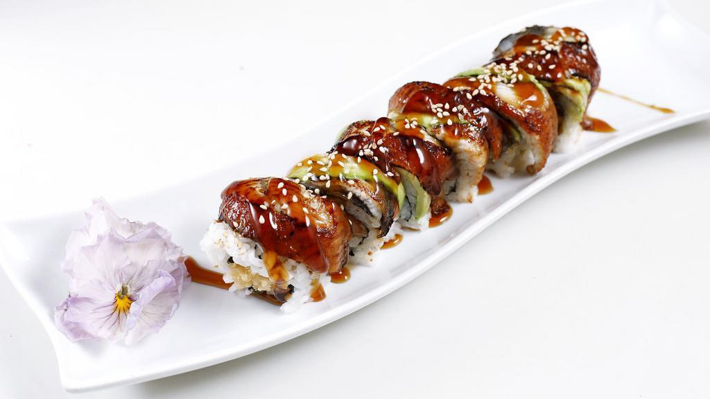 Dragon Roll · Shrimp tempura topped with choice of eel or albacore. Roll with sesame seed.
