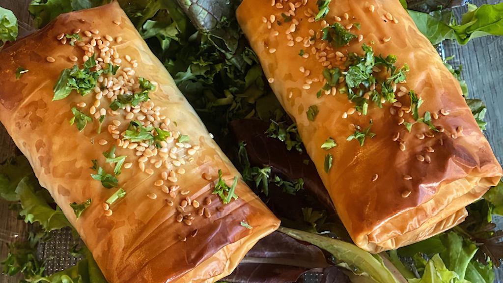 Spanakopita · Spinach, feta cheese, puff pastry served with tzatziki sauce