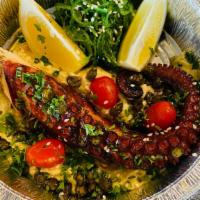 Octapodaki Tou Yiorgou · Grilled octopus a bed of chimichurri hummus, seaweed salad, fried capers s/w lemon and extra...
