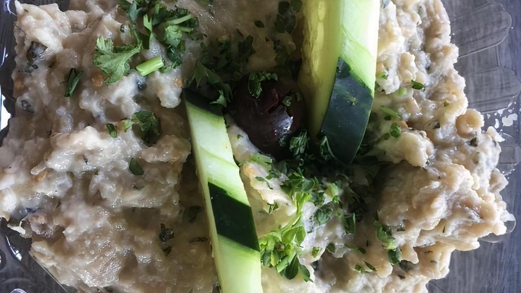 Baba Ghanoush · Gluten-free, vegetarian. Smoked eggplant, imported tahini, mint, garlic, lemon with extra virgin olive oil.