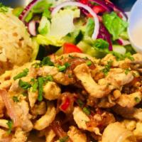 Chicken Shawarma · Thinly sliced chickens, cooked with red onions on the flat grill, served w/rice with orzo an...