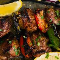 Lamb Skewers · 2 lamb skewers with our special marinade made with fresh herbs, served w/ rice with orzo, gr...
