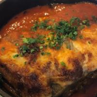 Meat Moussaka · Grilled eggplant, meat sauce, mozzarella cheese, bechamel sauce, served w/rice with orzo