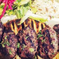 Kofte Kebap · 5 ground beef meatballs w/herbs & onions, served w/ rice with orzo, grilled tomato and sumac...