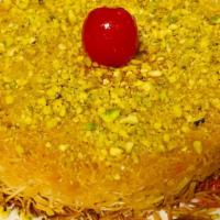 Kunefe · Turkish traditional delight, angel hair dough stuffing with sweet cheese, simple syrup and p...