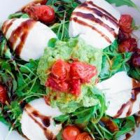 Caprese Salad · Imported Bufala Mozzarella,. Roasted Tomatoes, Pesto,. Avocado, Balsamic Glaze on Bed of. Se...