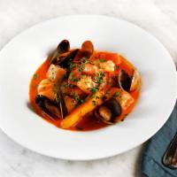 Seafood & Shellfish Stew “Bizkaiko” · Clams, mussels, scallops, prawns, halibut, fingerling, and red pepper sauce.