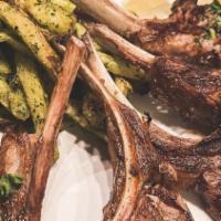 Lamb Lollipop · Lightly herbed lamb chops with garlicky fries.
