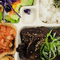 Korean Short Rib · Premium center cut beef.

Served w/Salad, Rice & Side Dishes.