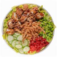 Chicken Katsu  · Shredded green cabbage, cucumber, edamame, red pickled daikon, crispy wonton strips, green o...