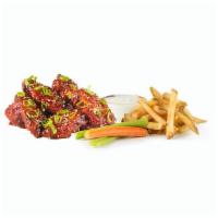 12 Wing Combo · 12 wings, a choice of 2 flavors, 2 house-made sauces, fries and carrots and celery.