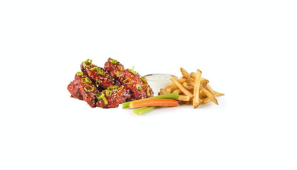12 Wing Combo · 12 wings, a choice of 2 flavors, 2 house-made sauces, fries and carrots and celery.