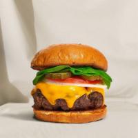 Cheese Catalyst Vegan Burger · Seasoned Beyond Meat patty topped with melted vegan cheese, lettuce, tomato, onion, and pick...