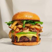 Fried Feast Fries Vegan Burger · Seasoned Beyond Meat patty topped with fries, avocado, melted vegan cheese, caramelized onio...