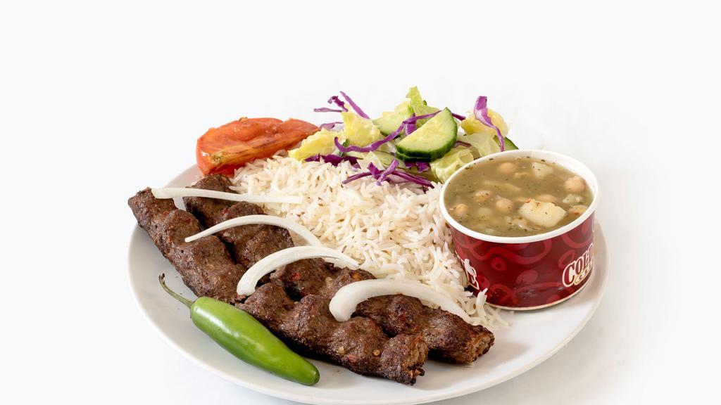 Shami Kabob · 2 skewer of fresh ground beef seasoned in our special seasoning , served with basmati rice , grilled vegetables , salad and bread