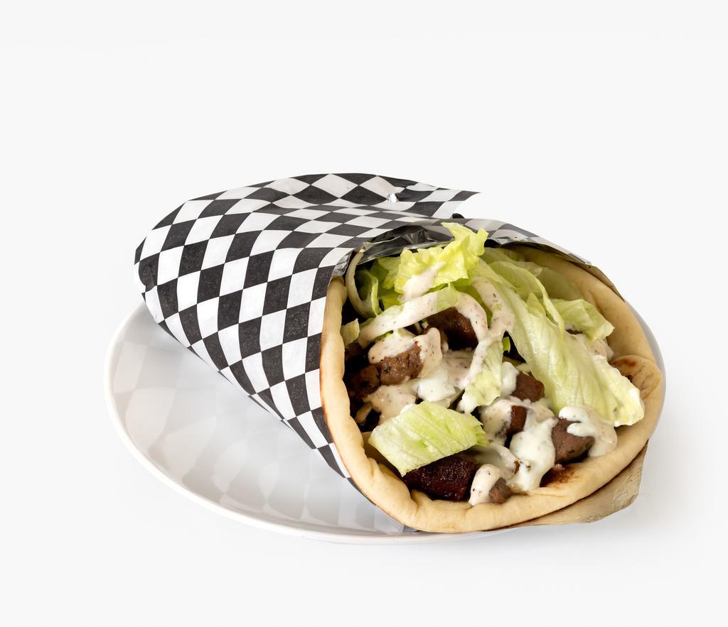Beef gyro · Served with mixed green salad , pita bread, tzatziki sauce   yogurt ranch and side of french fries