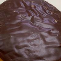 Chocolate Covered Custard Cream Filled Donut · A basic raised donut with custard cream filling.