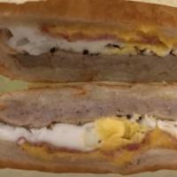 Sausage, Bacon & Egg Breakfast Sandwich · Sausage, bacon, egg, and cheese on croissant.