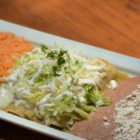 Enchiladas Suizas · Two green enchiladas with your choice of meat.
Served with lettuce, sour cream, melted chees...
