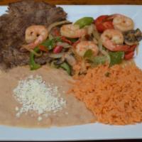 Bistec Con Camarones · Shrimp and grilled steak sautéed with a spicy diablo sauce, served with cactus, black beans,...