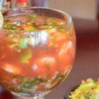 Coctel De Camaron · Shrimp, lime, onion, cilantro, tomato, and avocado.