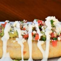 Chimichanga · Choice of meat, rice, refried beans, and cheese. Topped with sour cream, pico, guacamole, an...