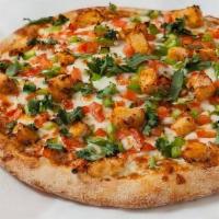 Butter Chicken Pizza · Butter sauce, chicken, diced tomatoes, diced bell peppers, and fresh cilantro.