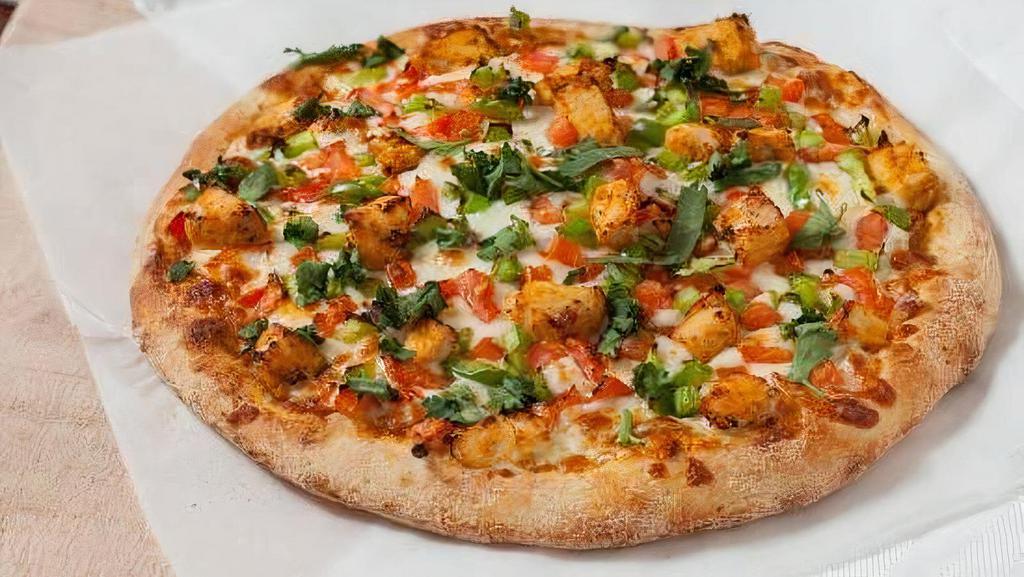 Butter Chicken Pizza · Butter sauce, chicken, diced tomatoes, diced bell peppers, and fresh cilantro.