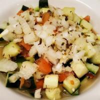 Salad Shirazi · Diced cucumber, tomato and red onion drizzled with the house lemon juice dressing.