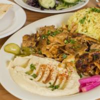 Chicken Shawarma Plate · Thinly sliced Shawerma .  Cooked on our specialized upright rotisserie .   Served with rice,...
