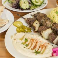 Beef Kabob Plate · 2 skewers of Tri-tip beef marinated with onions and spices, skewered and grilled .   Served ...