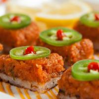 Crispy Rice With Spicy Tuna  (1.2.) · Spicy tuna over a layer of crispy rice & spicy aioli topped with jalapenos & sriracha