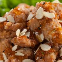 Almond Chicken  (1.2.) · Seasoned chicken lightly-fried with green onions, chilli powder and almonds drizzled with te...