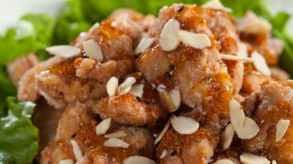 Almond Chicken  (1.2.) · Seasoned chicken lightly-fried with green onions, chilli powder and almonds drizzled with teriyaki sauce.