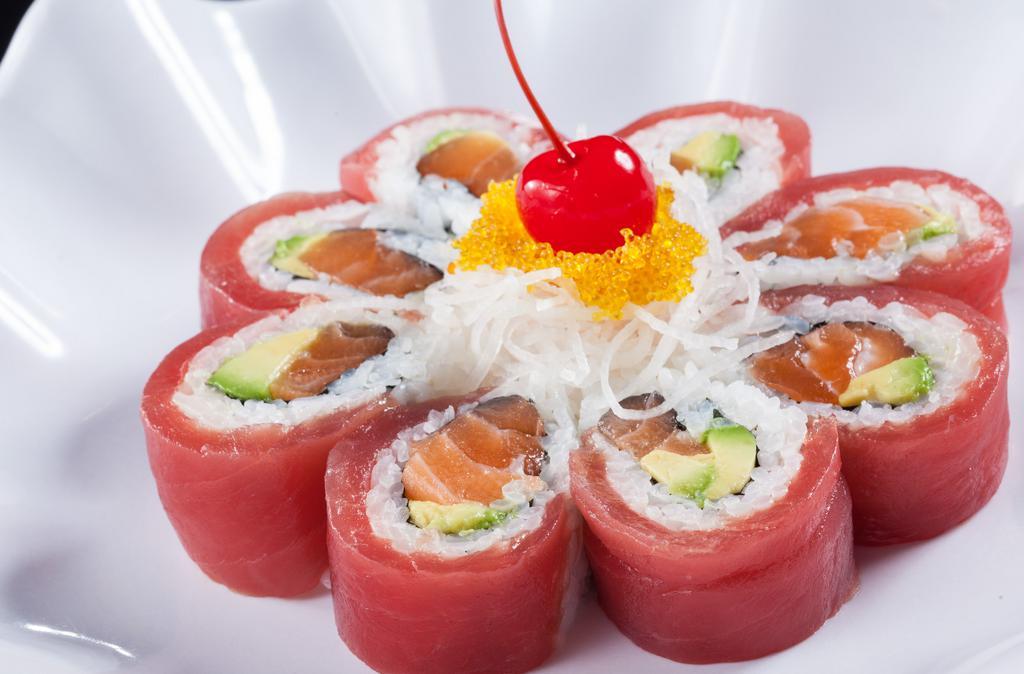 Cherry Blossom  (1.2.) · Salmon and avocado wrapped with tuna, topped with tobiko, daikon and cherry.