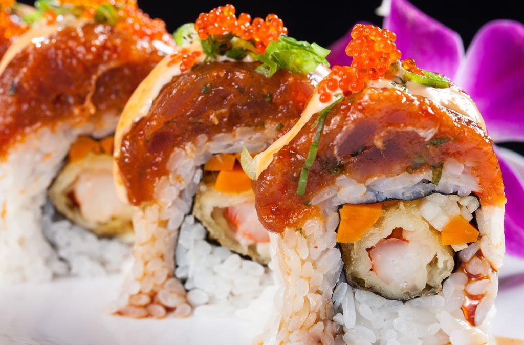 Red Dragon  (1.2.) · Spicy. Shrimp tempura and cucumber topped with spicy tuna, tobiko, green onions, unagi sauce, spicy aioli, and red onions.