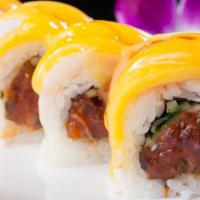Hot Mango  (1.2.) · Spicy. Spicy tuna roll and cucumber topped with yellowtail, mango drizzled with unagi sauce ...